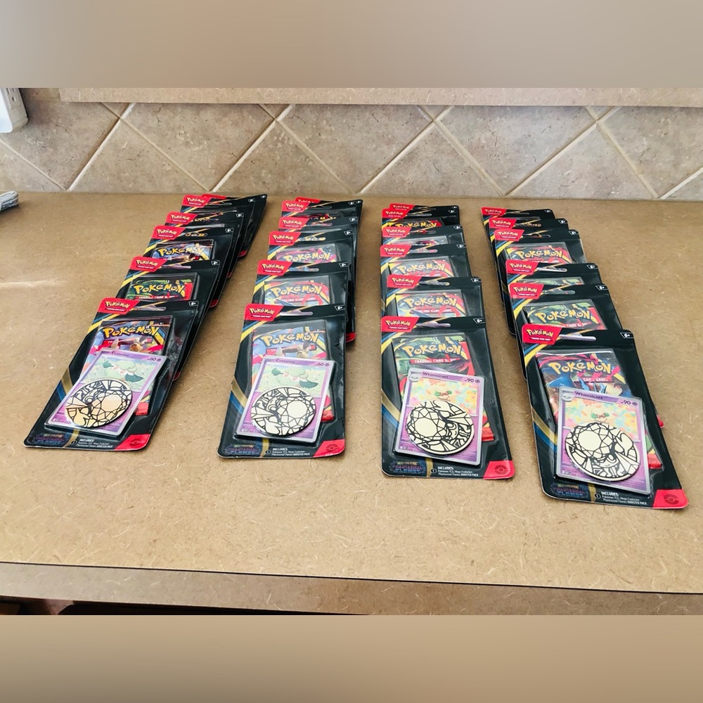 24 packs of Pokemon Card Collection with Red and Black Packaging